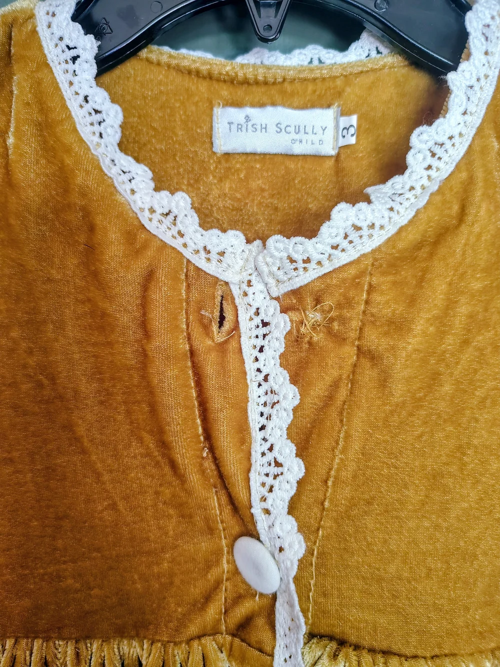 Trish Scully top button
